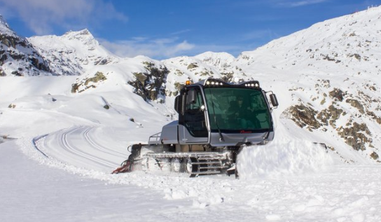 image of Husky snow groomer grooming snow on mountain