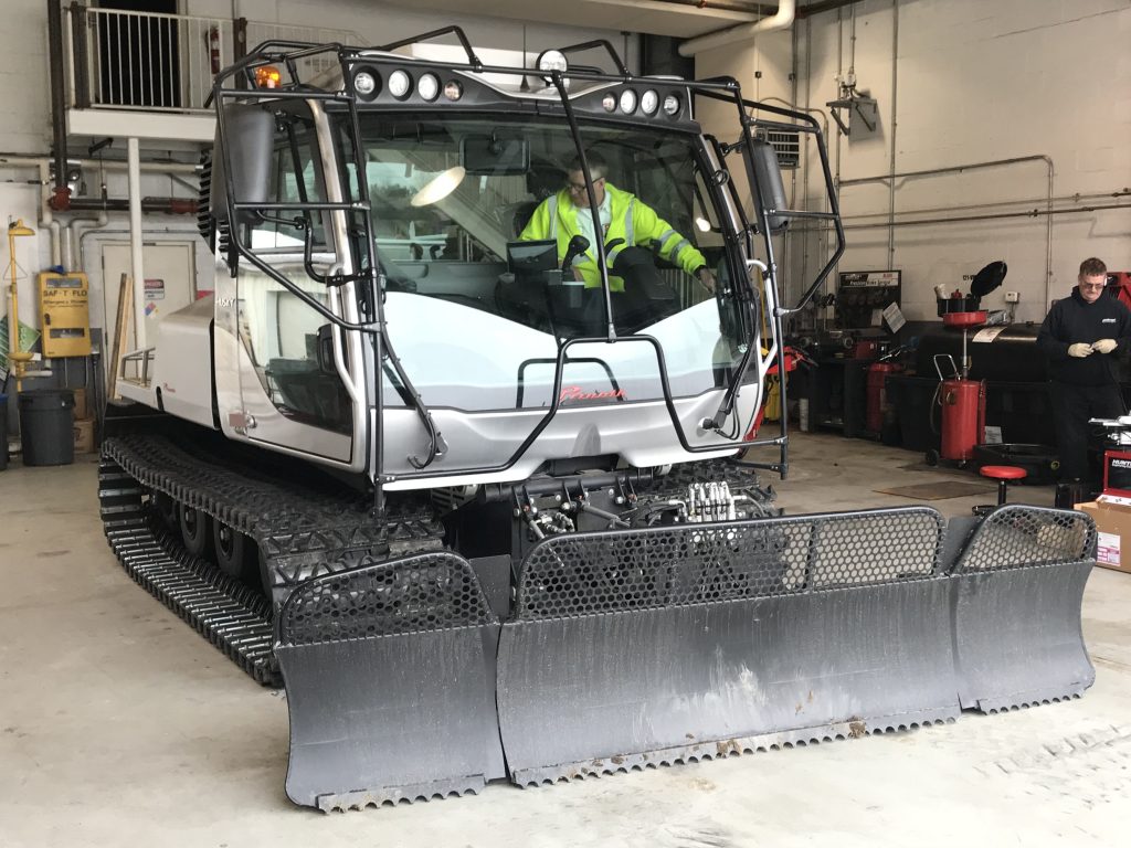 photo of Husky snow plow in garage