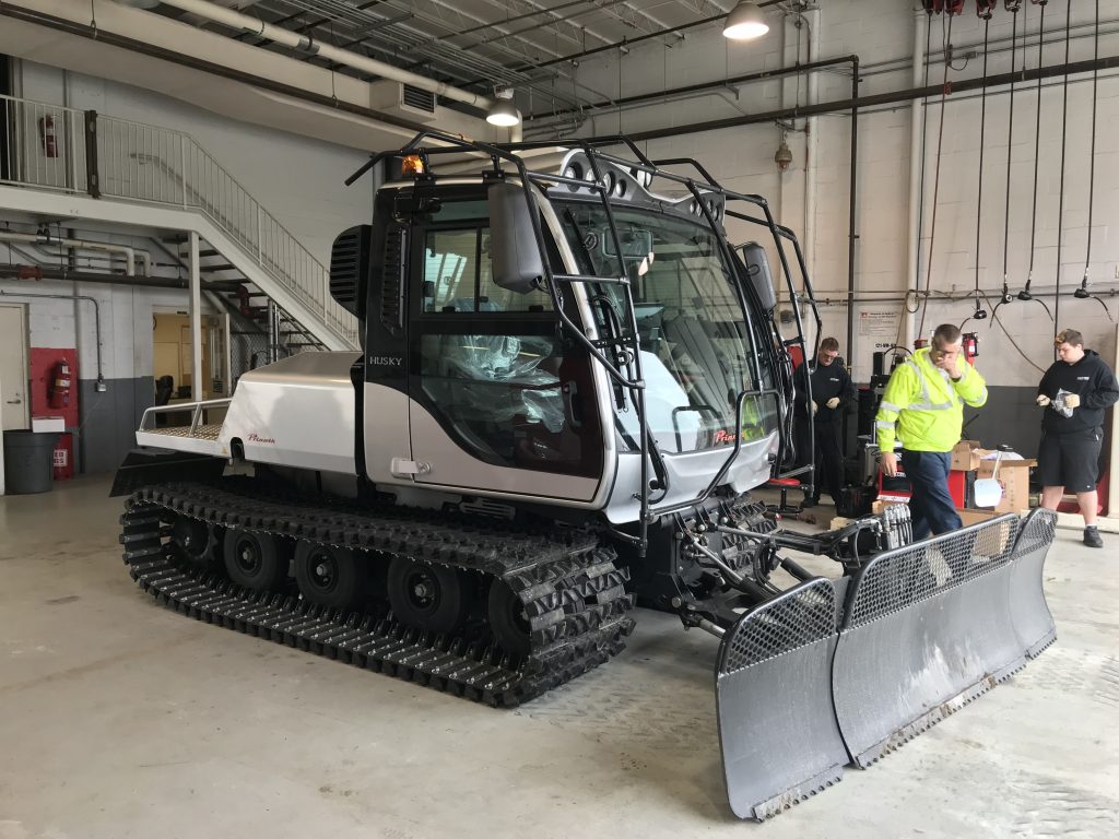 image of the Husky snow plow in garage