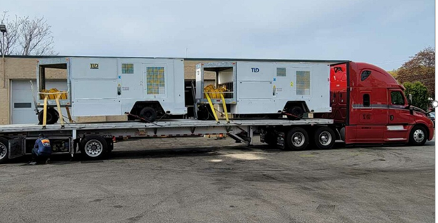 image of flat bed tractor trailor truck containing power starters