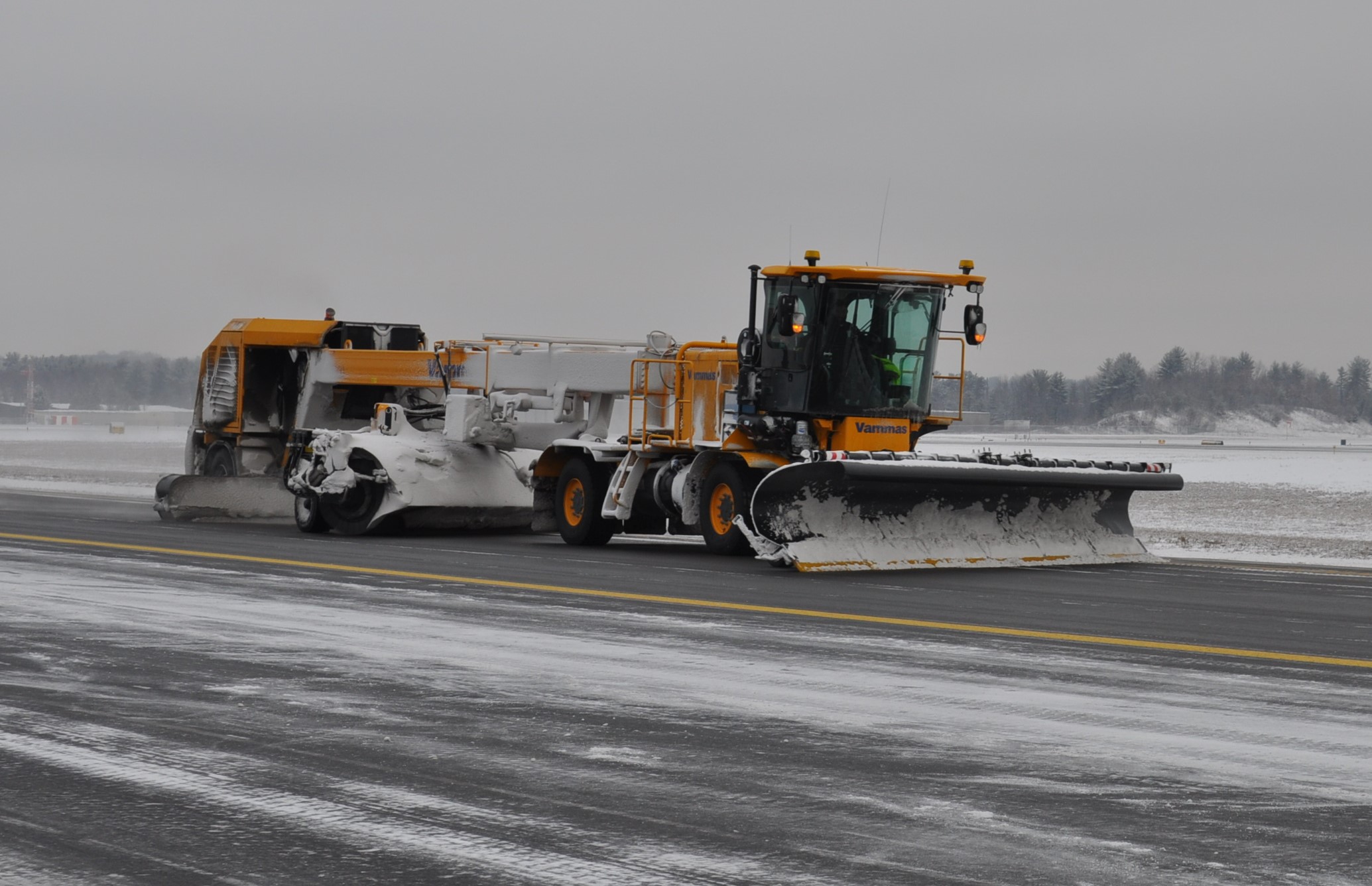 Vammas STSB5500 snow removal vehicle operating on a snowy runway.