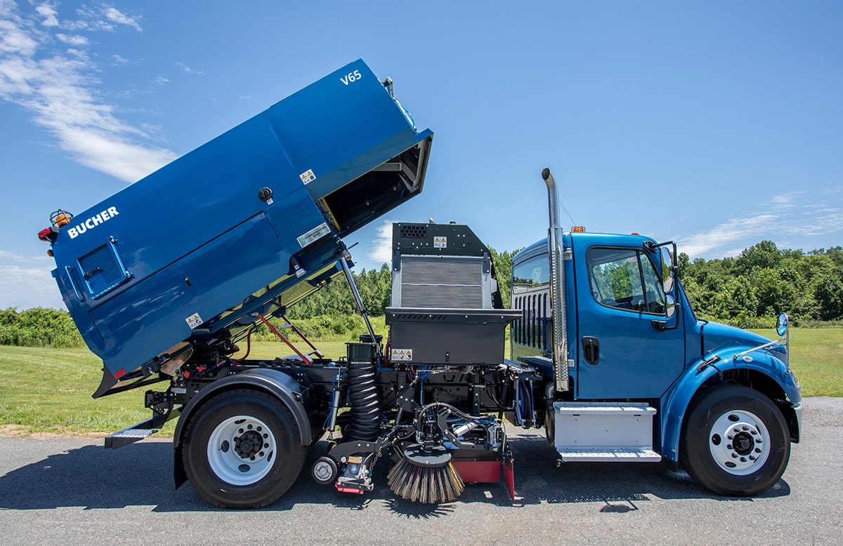 Bucher V65 pure vacuum sweeper in raised hopper position, side view